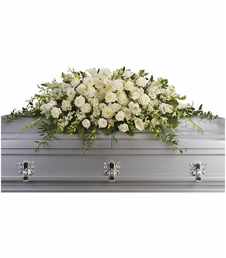 Casket spray flowers on casket